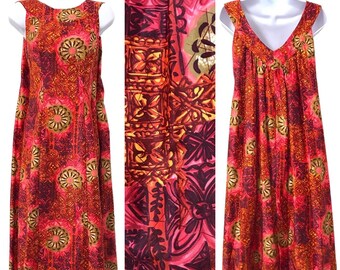 May include: A sleeveless maxi dress with a vibrant red, orange, and gold floral print. The dress has a V-neckline and a gathered bodice.