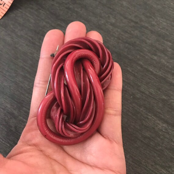 Early plastic celluloid knot pin brooch