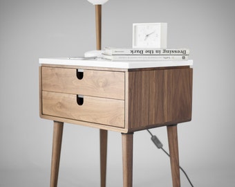 Nightstand bedside table with two drawers in solid Walnut wood board and on top Carrara marble