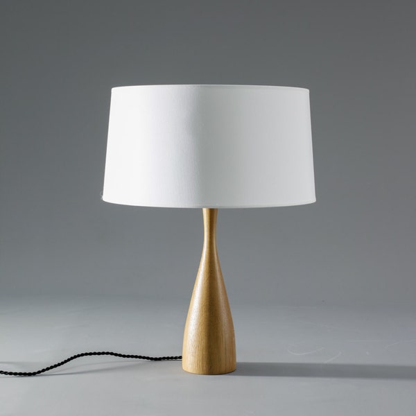 Scandinavian table lamp with turned wood body and cotton shade