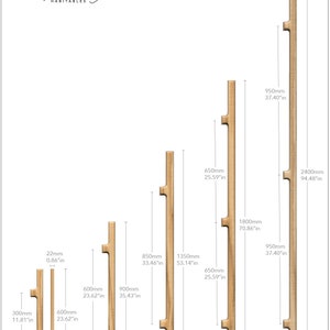 May include: Five different sizes of wooden door handles with measurements in inches and millimeters. The handles are all the same style, with a rectangular shape and a small cutout in the middle. The handles are shown against a white background.