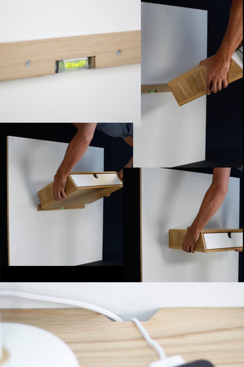 May include: A light wood floating shelf with a white drawer is being installed on a white wall. A level is used to ensure the shelf is straight. The shelf is being held up by a person's hands.