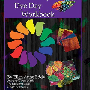 May include: A purple book cover with the title "Ellen Anne Eddy's Dye Day Workbook" and the author's name "Ellen Anne Eddy". The cover features a rainbow color wheel, a frog, and fabric swatches.