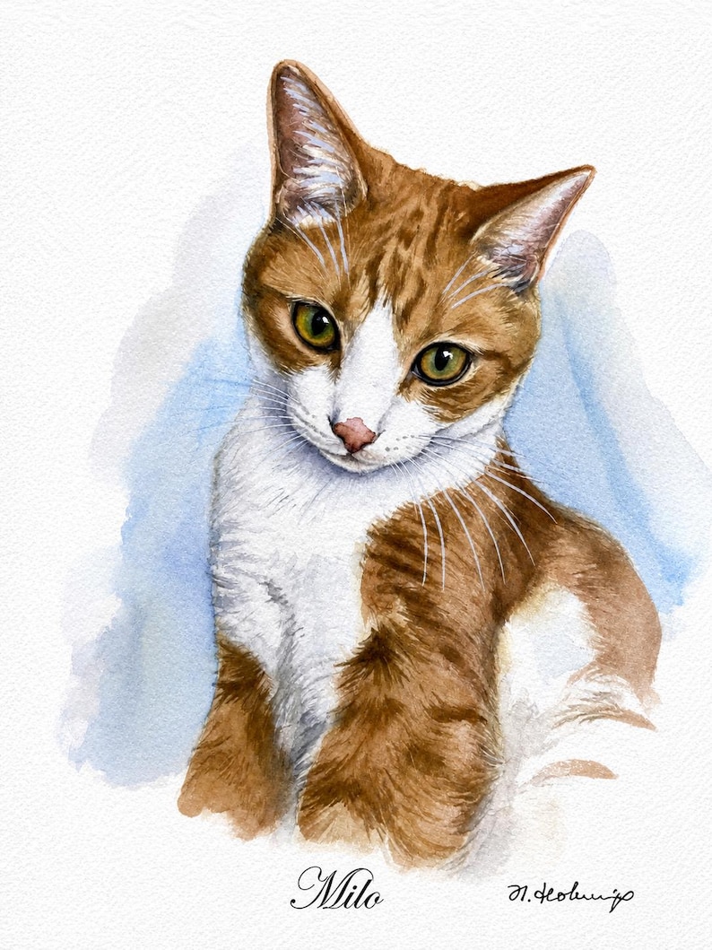 A watercolor painting of a ginger and white cat with green eyes, looking downward. The cat has a white chest and face markings with orange tabby fur. The name Milo is written in cursive script at the bottom with a signature next to it.
