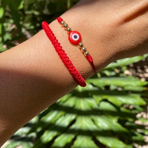 Rode reeks. Rode koordarmband. Chinese knooparmband. Mal de ojo. Slang knoop. Boze oog armband