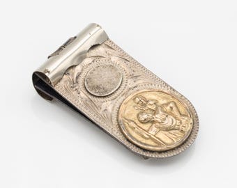Clipe para dinheiro com medalhão de São Cristóvão em prata de lei 925 e ouro 13 quilates de Taxco, México.