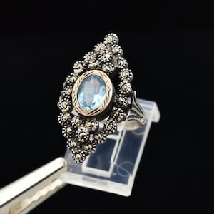 May include: A set of three ceramic mugs with a speckled, matte finish. The mugs are in shades of cream, light brown, and dark brown. Each mug has a simple, minimalist design, perfect for coffee or tea.