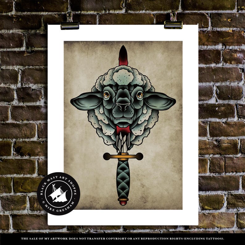 May include: A black and white illustration of a sheep's head with a dagger through it. The sheep has a red bow tie. The illustration is in a traditional tattoo style. The text "BLACK MAST ART SHOPPE" and "MIKE GRESHAM" is at the bottom of the image.