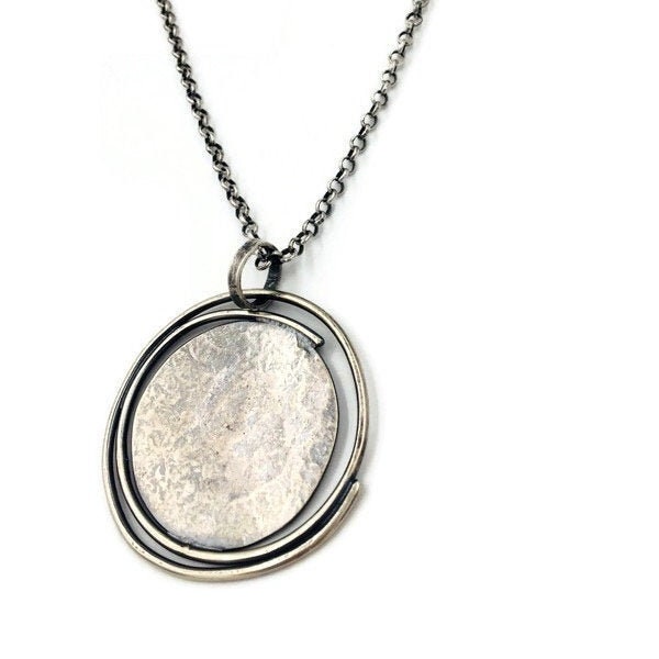 Sterling silver Orbit pendant on chain. Lisa Colby Metalsmith