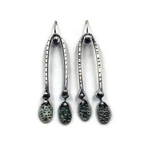 Long, elegant drop earrings with pebble dangles . Lisa Colby Metalsmith. (E313)