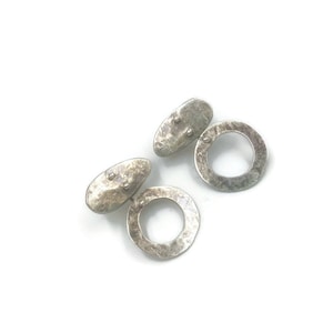 Sterling silver pebble hoop studs.