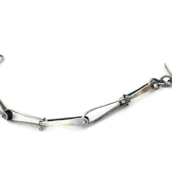 Sterling silver “Flare link” bracelet. Minimal, modern, unisex.