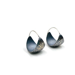 Sterling silver hammered hoop earrings.