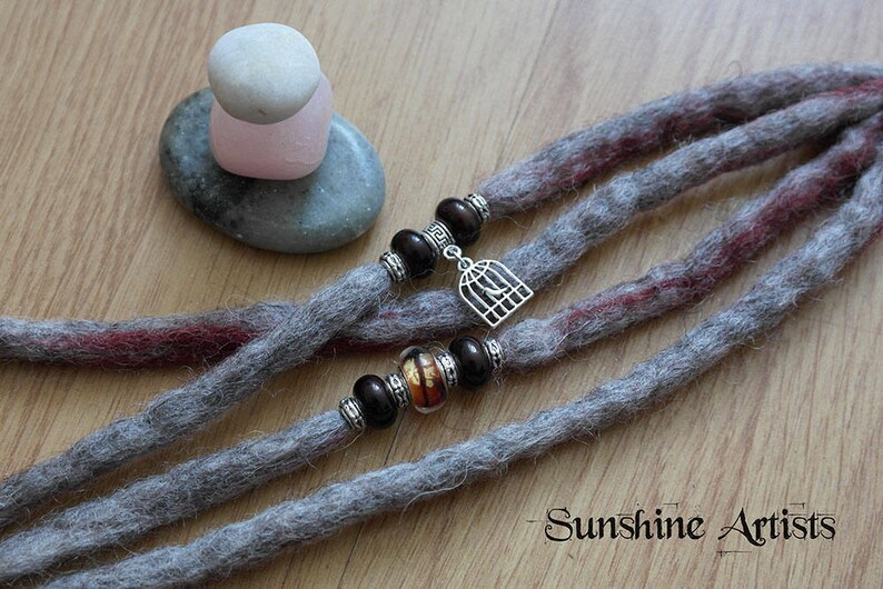 Light grey dreads Tibetan silver clip in extensions bird lover Merino wool birdcage charm burgundy highlights tiger eye glass bead
