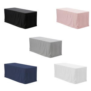 May include: Five tablecloths in different colors: black, pink, gray, navy blue, and white. The tablecloths are draped over rectangular tables.