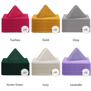 May include: Ten packs of fabric napkins in six different colours: fuchsia, gold, grey, hunter green, ivory, and lavender. Each pack contains ten napkins.
