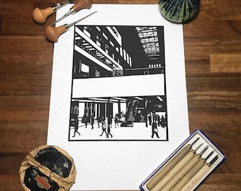 May include: A black and white linocut print of a modern building with people walking inside. The print is on white paper and is framed with a white mat.