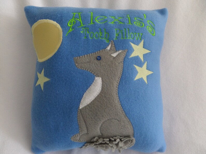 The wolf is watching the pocket moon to see when the tooth fairy will come. The glow in the dark stars and moon outline helps him to see. image 1
