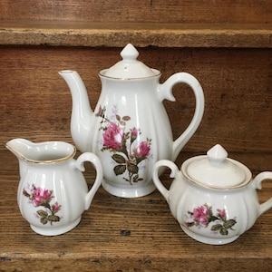 May include: A rustic wooden sign with the text "Welcome to our home" in a handwritten style. The sign features a distressed finish and a simple, inviting design, perfect for entryway decor.