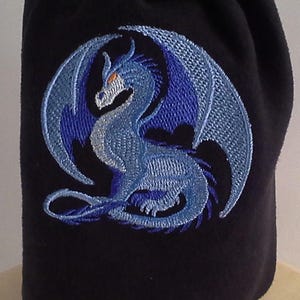 May include: A black fabric bag with a blue embroidered dragon design.