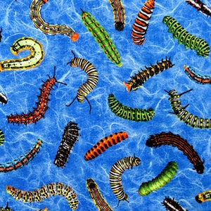 May include: A blue fabric with a repeating pattern of colorful caterpillars. The caterpillars are in various poses and have different colors and patterns.