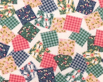May include: A fabric pattern featuring a patchwork design with various square patches. The squares display floral, gingham, and leaf patterns in shades of pink, green, blue, and yellow on a white background. The edges of the squares have a decorative, scalloped edge.