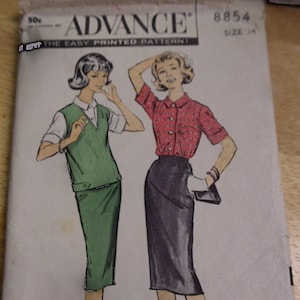 May include: A vintage sewing pattern for a skirt and top. The pattern is from Advance, the easy printed pattern, and is size 14. The pattern shows two women wearing the skirt and top. One woman is wearing a green skirt and a white top with a green vest. The other woman is wearing a black skirt and a red and white patterned top.