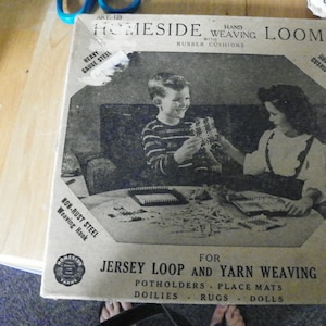 May include: Homeside Hand Weaving Loom with rubber cushions, heavy gauge steel weaving hook, and illustrated instructions.  The loom is designed for jersey loop and yarn weaving to create potholders, place mats, doilies, rugs, and dolls.