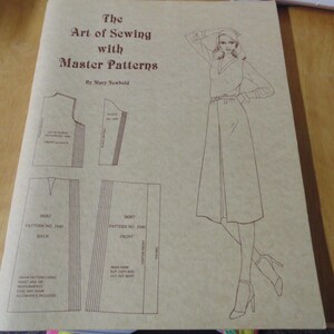 May include: A vintage sewing pattern book titled "The Art of Sewing with Master Patterns" by Mary Newbold. The cover features a line drawing of a woman in a dress and skirt patterns.