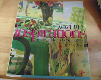 May include: A book titled "Waverly Inspirations: Your Guide to Personal Style" with a green, white, and floral patterned cover. The cover features a vase of pink flowers, a table with a bowl of fruit, and a chair with a floral patterned cushion.