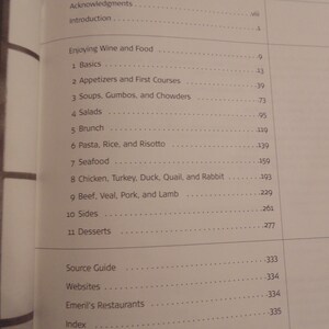 May include: A book's contents page, featuring a list of chapters and page numbers. The title "CONTENTS" is at the top. The topics include "Enjoying Wine and Food", "Appetizers", "Soups", "Salads", and "Desserts".
