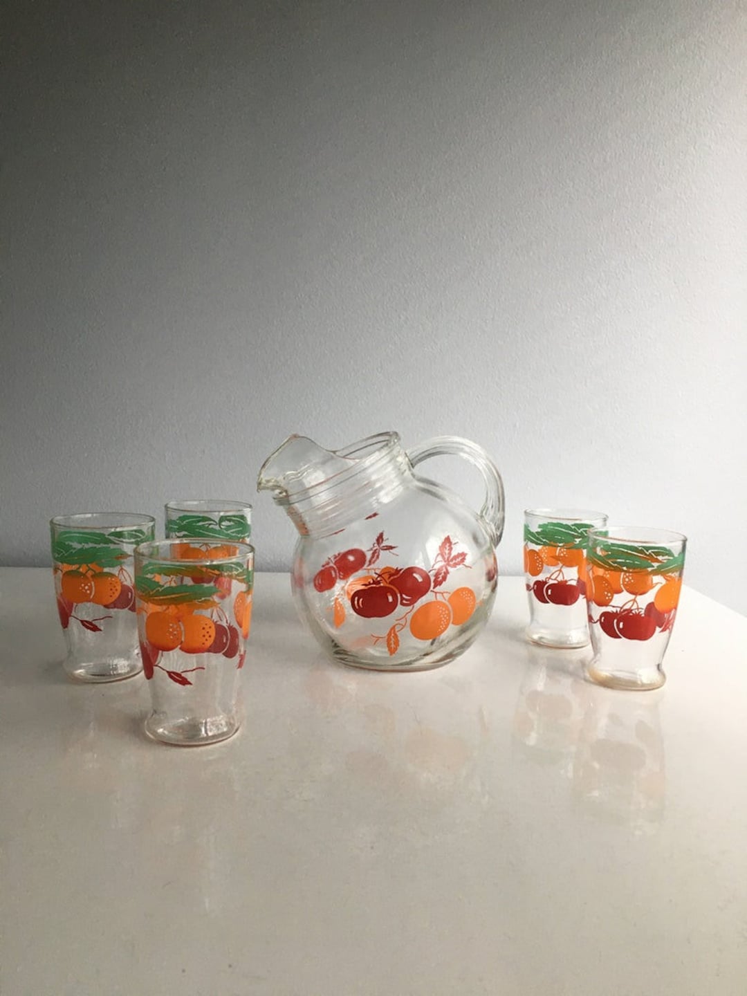 6 Anchor Hocking orange juice glasses with orange juice carafe in very good  condition