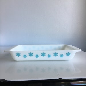 May include: White rectangular baking dish with a blue snowflake pattern.