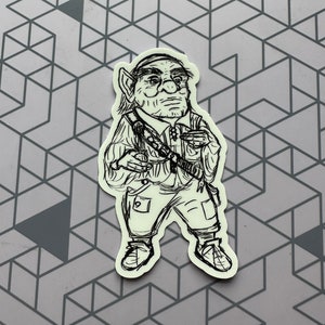 May include: A black and white line drawing of a cartoon goblin wearing a hat and holding a weapon. The goblin is standing with its legs spread apart and its arms outstretched.