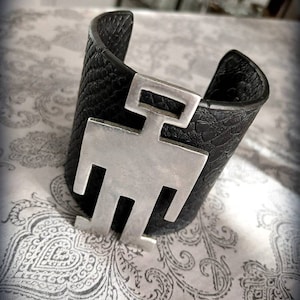 Cute Alert! Leather cuff...with abstract silhouette on it!
