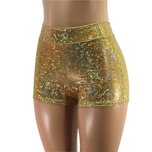May include: Gold iridescent shorts with a high waist and a shimmery finish.
