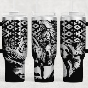 May include: A black and white stainless steel tumbler featuring a Native American riding a horse design. The tumbler has a black handle and a lid with a straw hole.