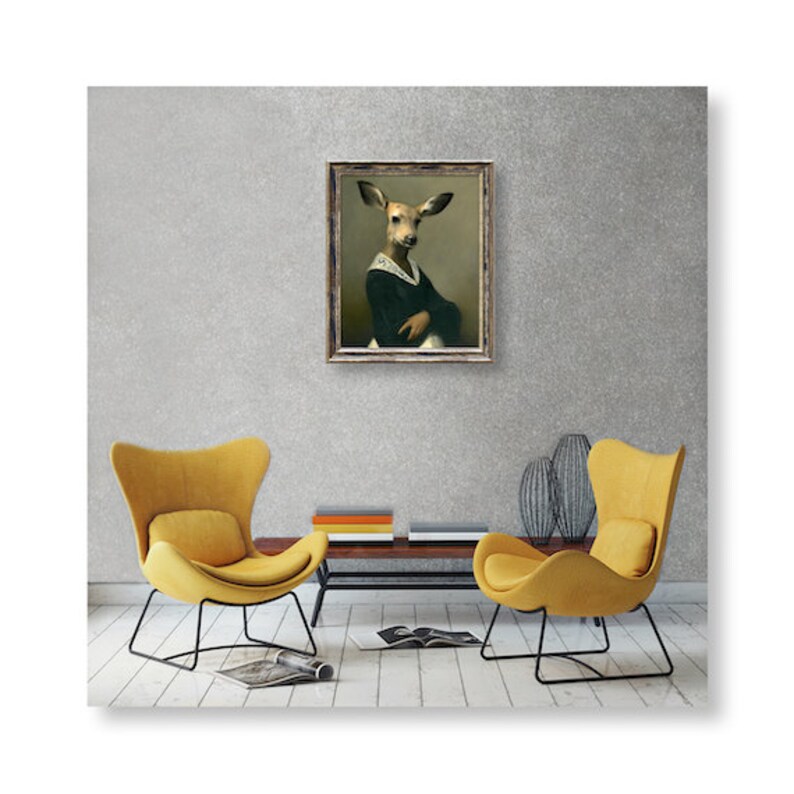 May include: A framed painting of a deer wearing a black dress and a white collar, hanging on a gray wall between two yellow armchairs.