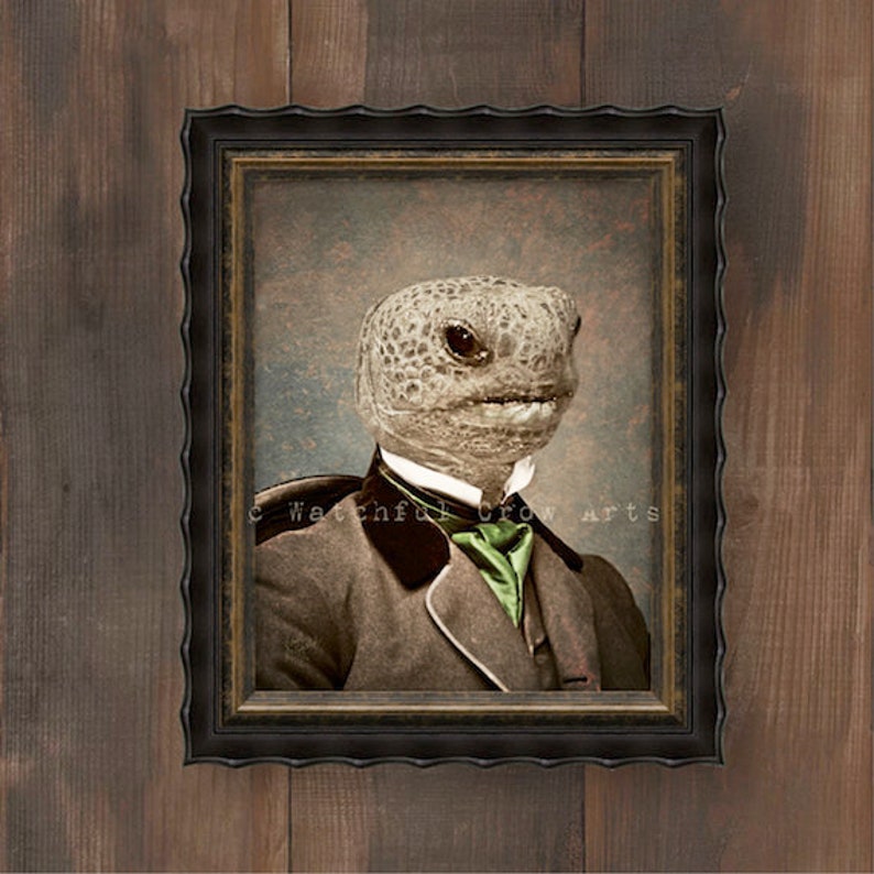 May include: Framed vintage portrait of a reptile wearing a suit and tie. The reptile has a textured head and is wearing a brown suit with a green tie. The frame is black and ornate.