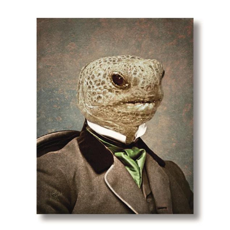 May include: A vintage-style portrait features a turtle's head superimposed on a person in formal attire. The turtle's head is a mottled tan color, and it wears a gray suit with a black lapel and a green ascot. The background is a muted, textured gray.