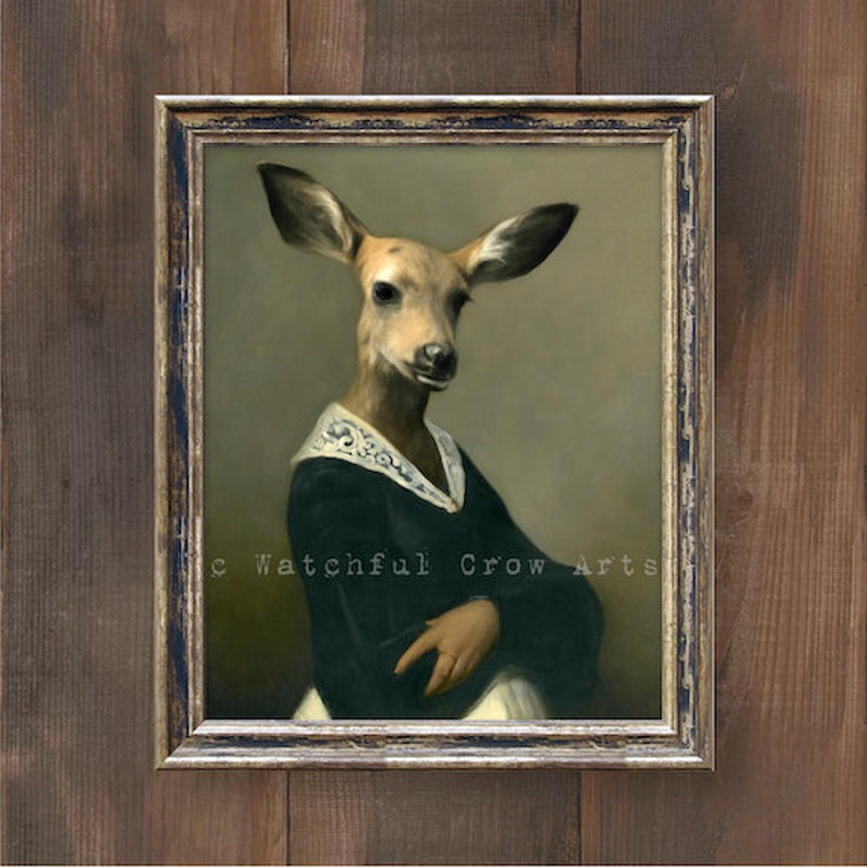 May include: A painting of a deer in a green dress with a white lace collar. The deer is looking at the viewer with a serious expression. The painting is framed in a gold frame.