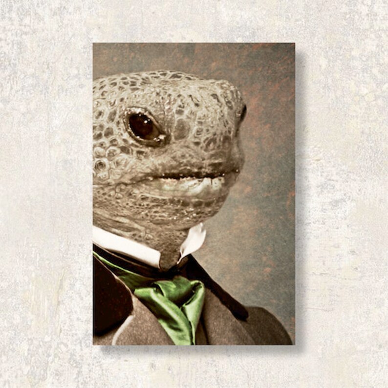 May include: A sepia-toned portrait of a tortoise wearing a suit jacket with a green satin tie. The tortoise has a textured, patterned shell and is looking to the side. The background is a muted, textured brown.