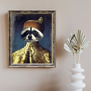 May include: A framed painting of a raccoon wearing a gold and brown turban and a gold and white patterned robe. The raccoon has a serious expression and is looking directly at the viewer.