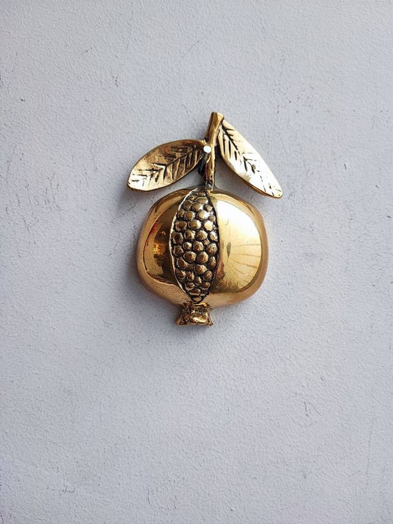 Brass pomegranate sculpture, vintage pomegranate figure, half a pomegranate with two leaves and seeds showing, Greek folk art