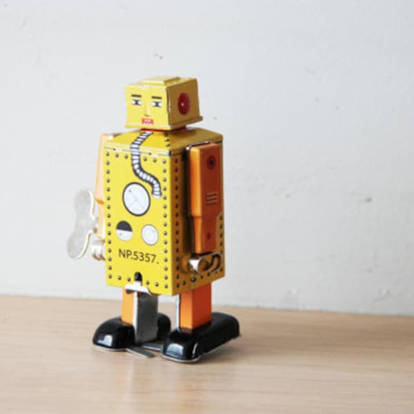 Vintage robot toy, yellow robot toy,  tin robot wind up toy in yellow, collectible, walking robot toy, Chinese, robot clockwork toy