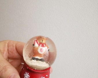 Vintage snow globe, teddy bear snowglobe with Santa hat and scarf, teddy in snowglobe, Xmas collectible teddy bear snowglobe on red base