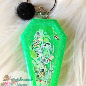 Zombie inspired coffin shaker keychain