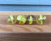 Cat 39 s eye marble yellow glass clear vintage toy game strand colored four set marbles strand cat vane banana old crystal