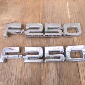 F 250 Emblem Large Truck Accessory Silver Plastic Peg Vintage Used Brand OEM Factory Authentic Real Original Model Number