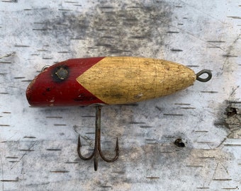 Old fishing lure vintage rustic worn weathered man cave decor cabin bar  cork wood chippy shabby red yellow